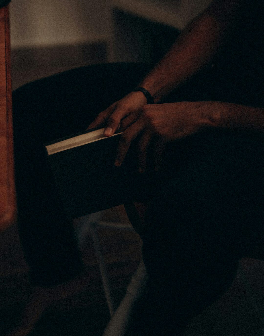 person reading book at night