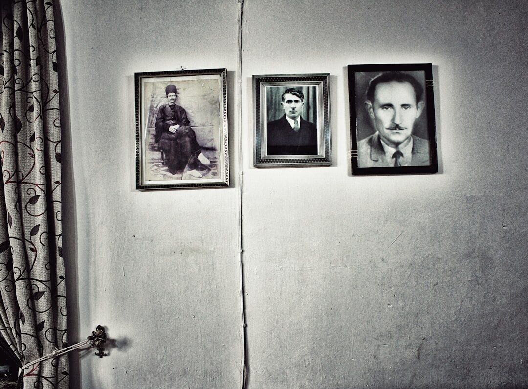 Portrait of a Croatian male mystery novelist with a grey beard wearing a dark coat